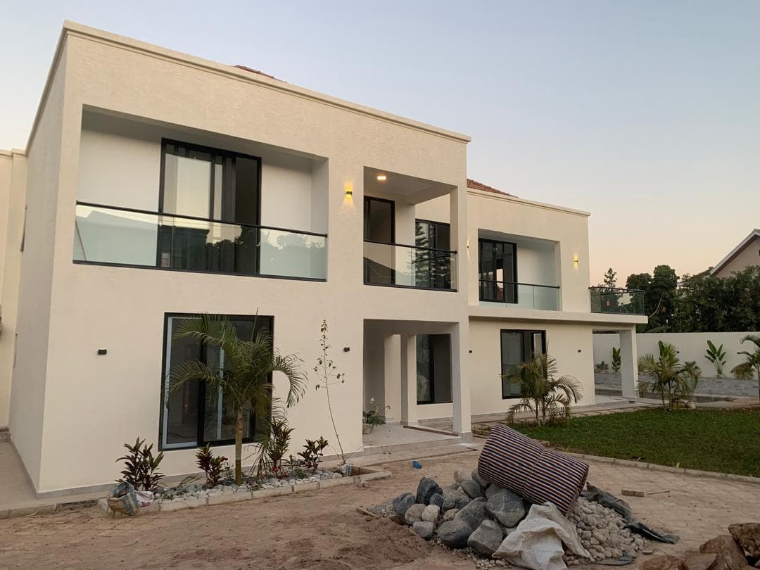 Aluminum-framed glass doors and balcony railings on a contemporary two-story home
