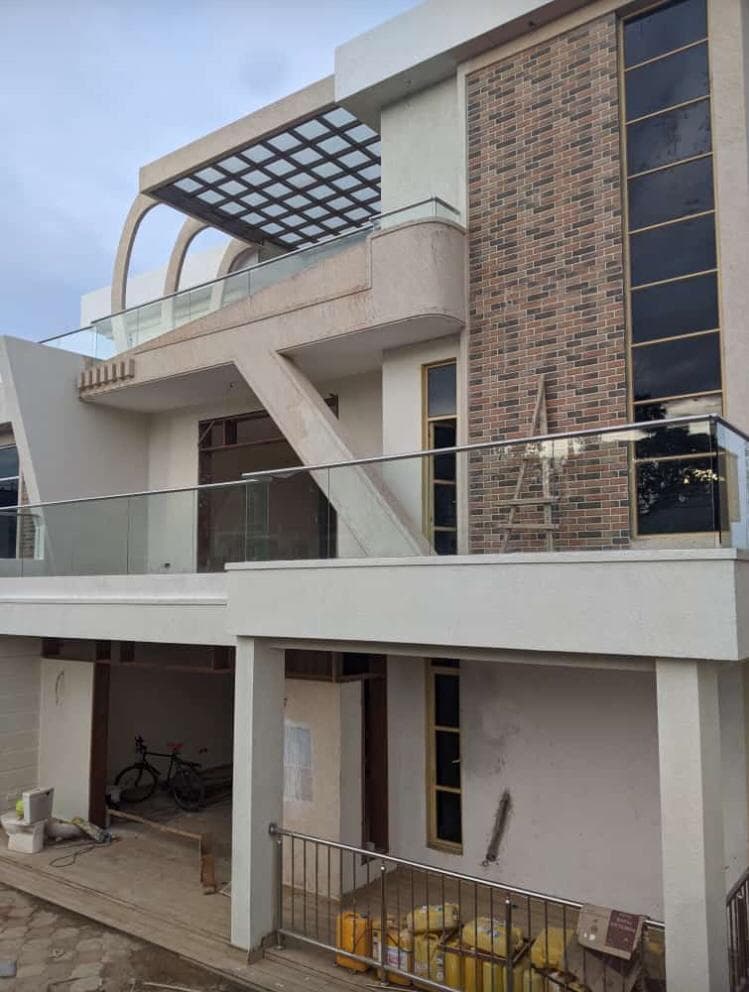Multi-level glass railings and pergola on a residential building